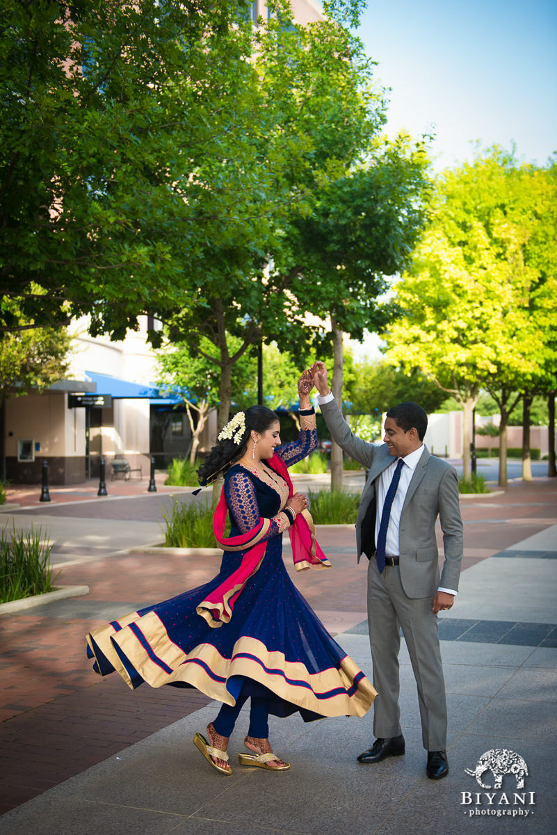 Fusion wedding couple twirling photo