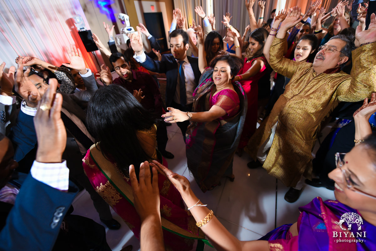 Wedding party dancing at reception at stafford center