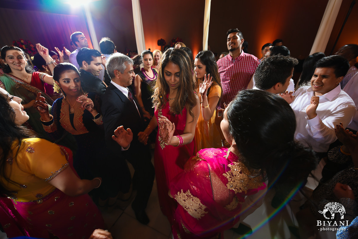 Bride and friends dancing at reception