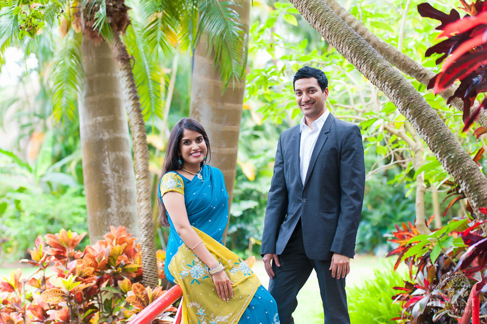 Engaged Indian couple posing for their Florida Indian Engagement Photography shoot at Sunken Gardens, St. Petersburg Florida