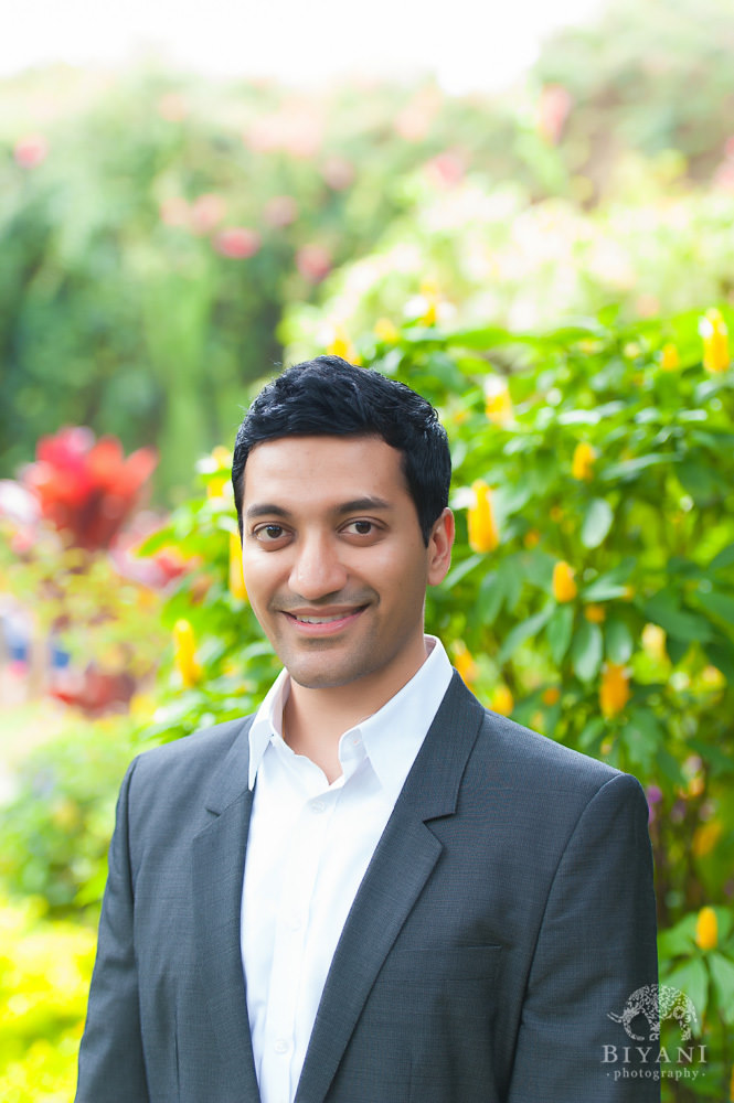 Indian Groom to be posing for his Florida Indian Engagement Photographer at Sunken Gardens in St. Petersburg Florida