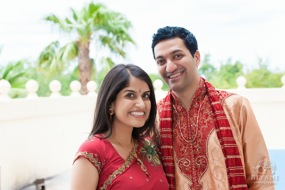 Indian Couple smiling during their Indian Engagement Photography shoot at the balcony of the Hindu Temple of Florida