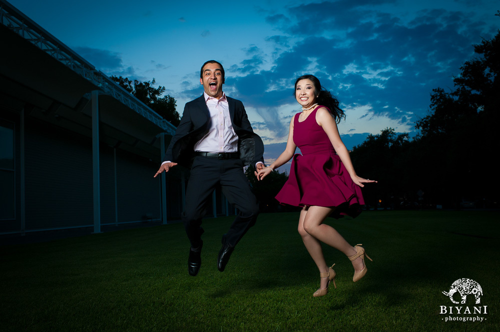 Jump shot of a couple outside the Menil Collection Houston at sunset