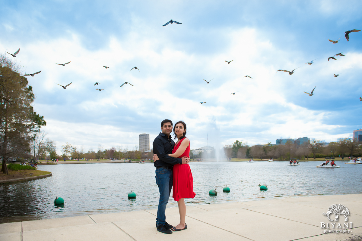 Epic Shot birds flying over recently engaged couple