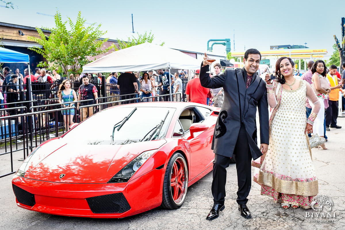 Indian Sangeet couple posing with fancy car - Lamborghini