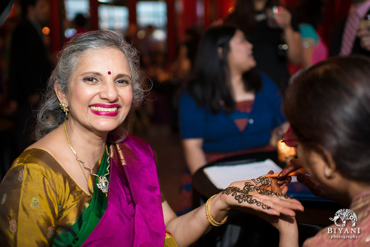 Brides mom getting hennda / mehendi done