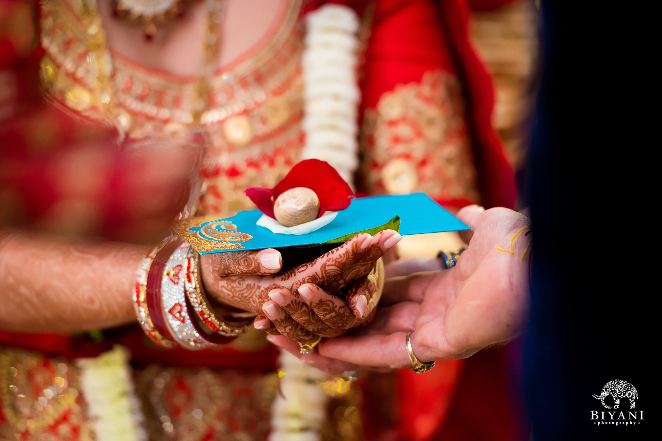 The bride offers gifts during Indian ceremony