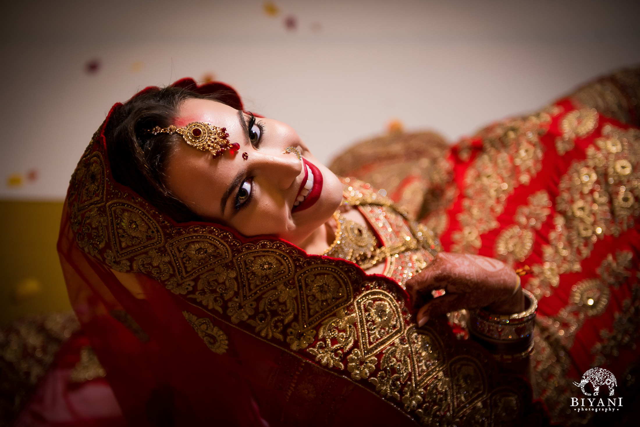 Bride poses in wedding ceremony outfit 