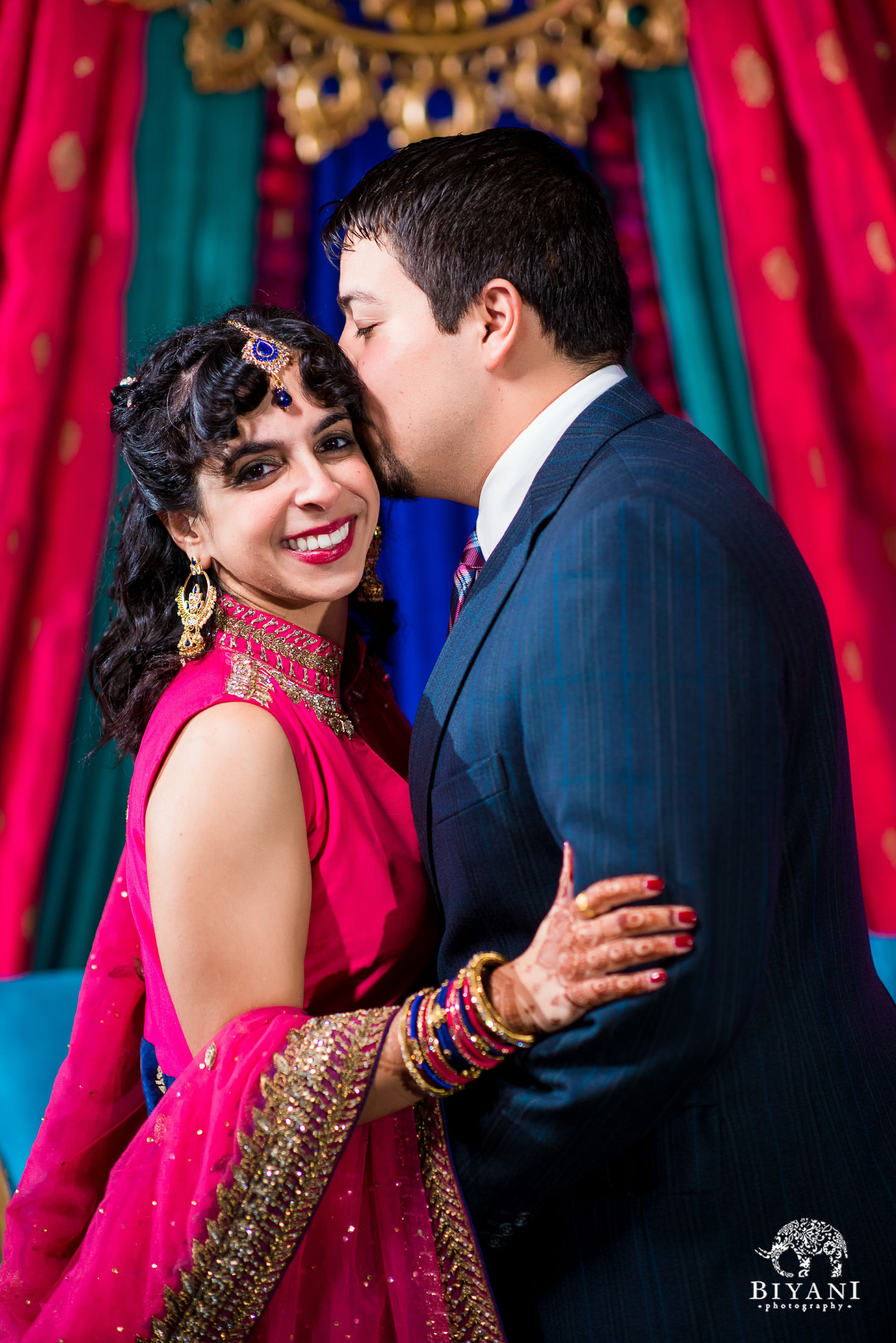 Indian Fusion Bride and Groom during couple portraits on the Mehendi night of their Indian Fusion wedding in San Antonio, Tx. 