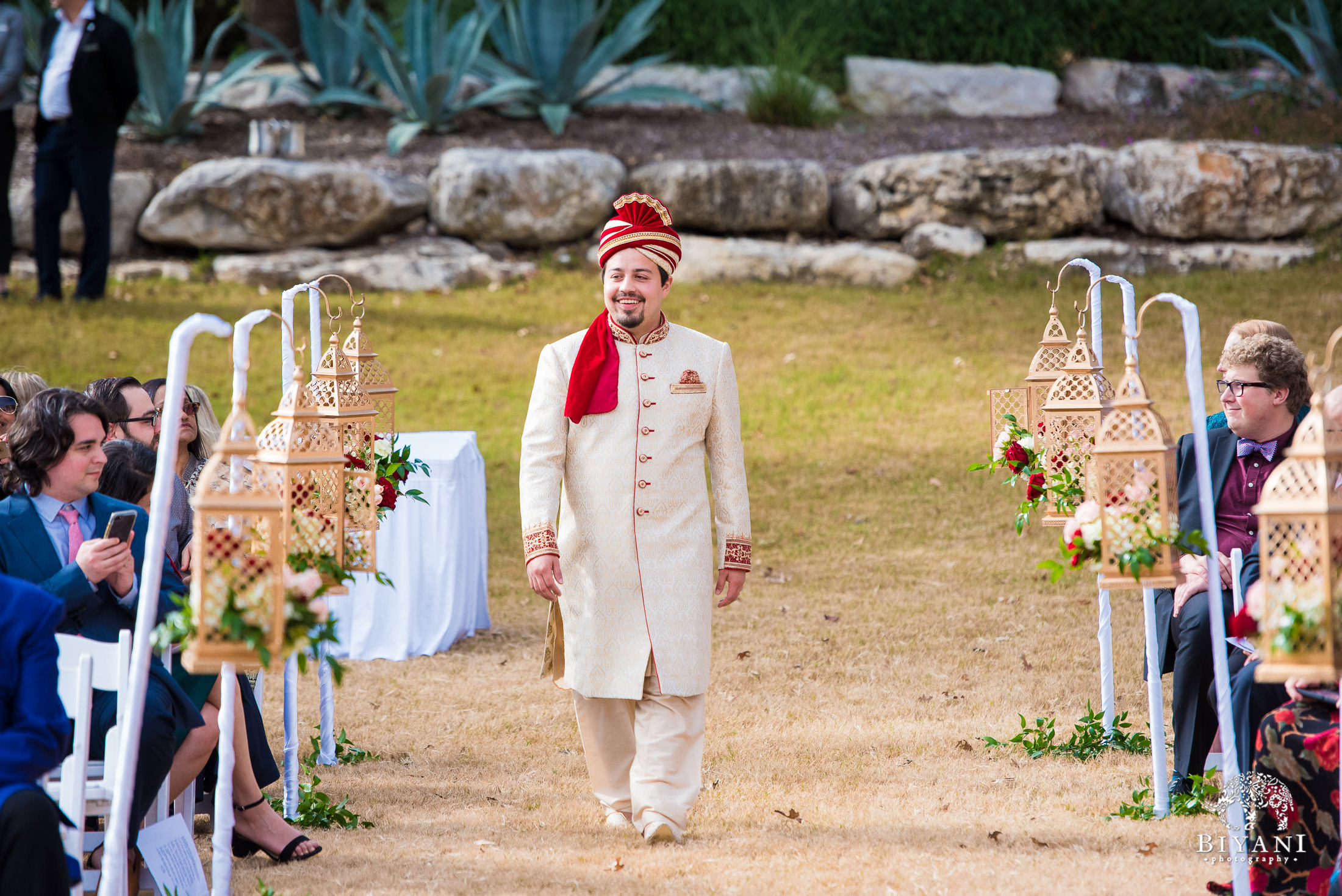 Indian Fusion Groom walking down the aisle during Indian wedding ceremony 