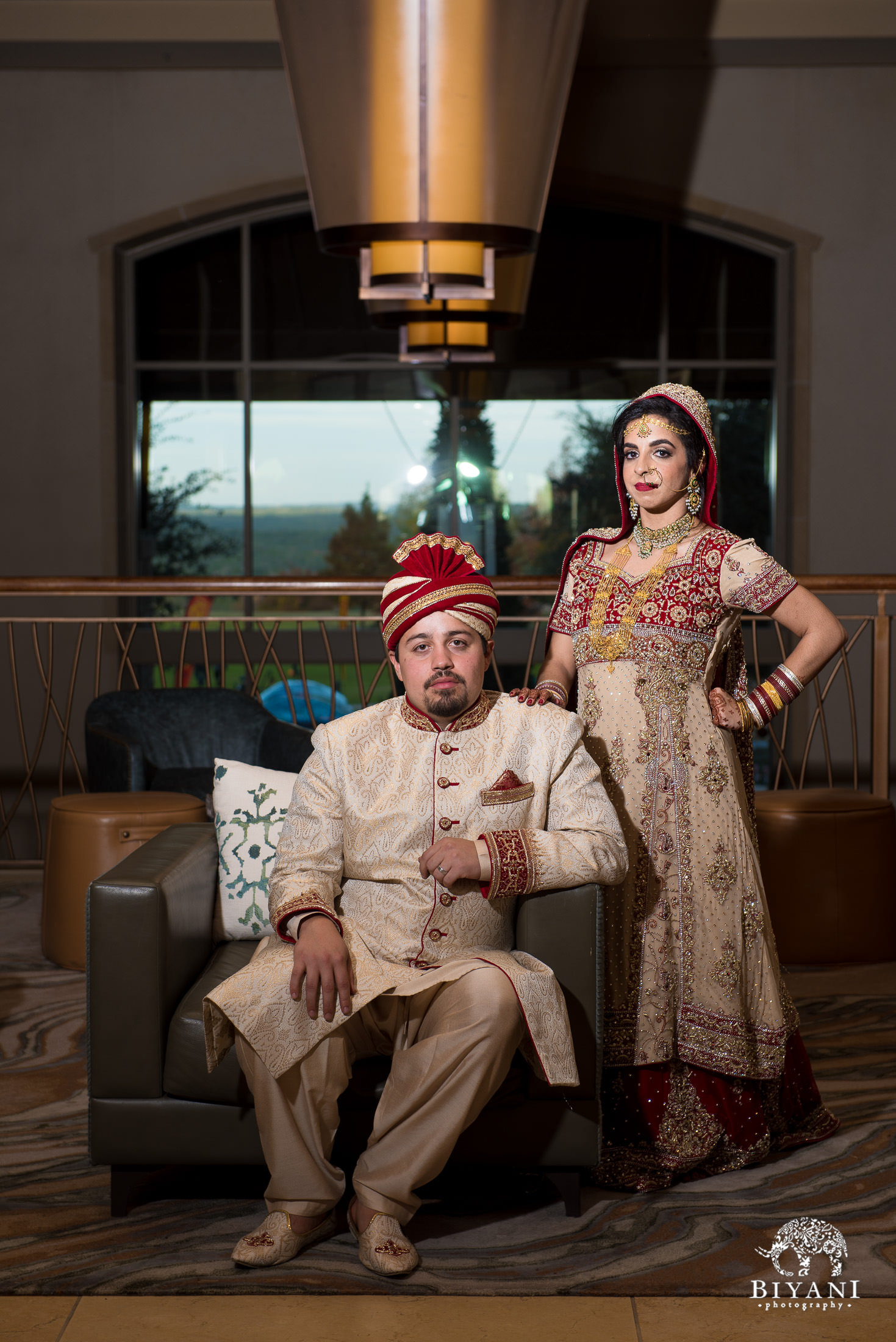 Indian Fusion bride and groom posing in hotel lobby after the wedding ceremony in San Antonio, Tx. 