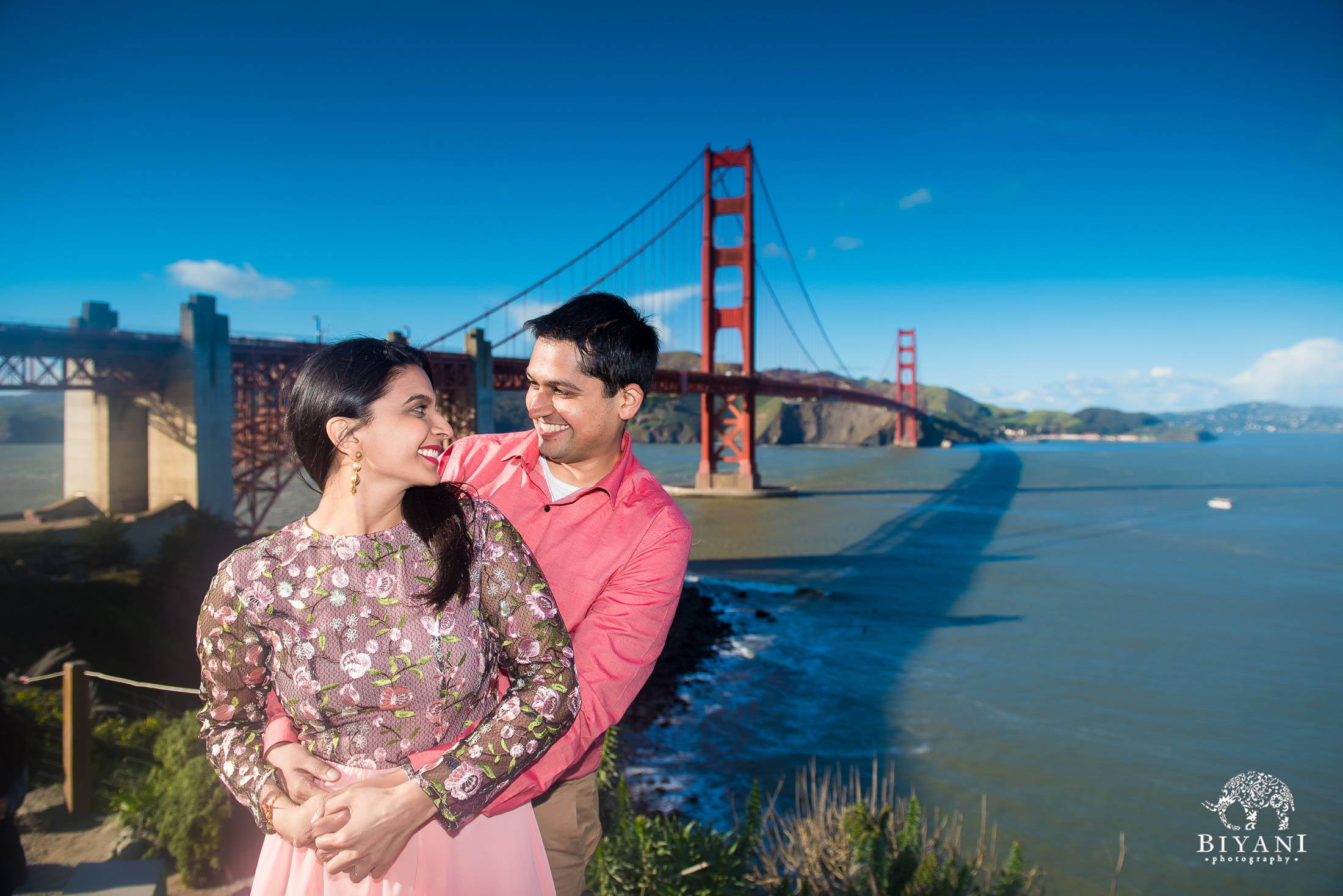 Engagement photo shoot in front of golden gate bridge in San Francisco during the day 